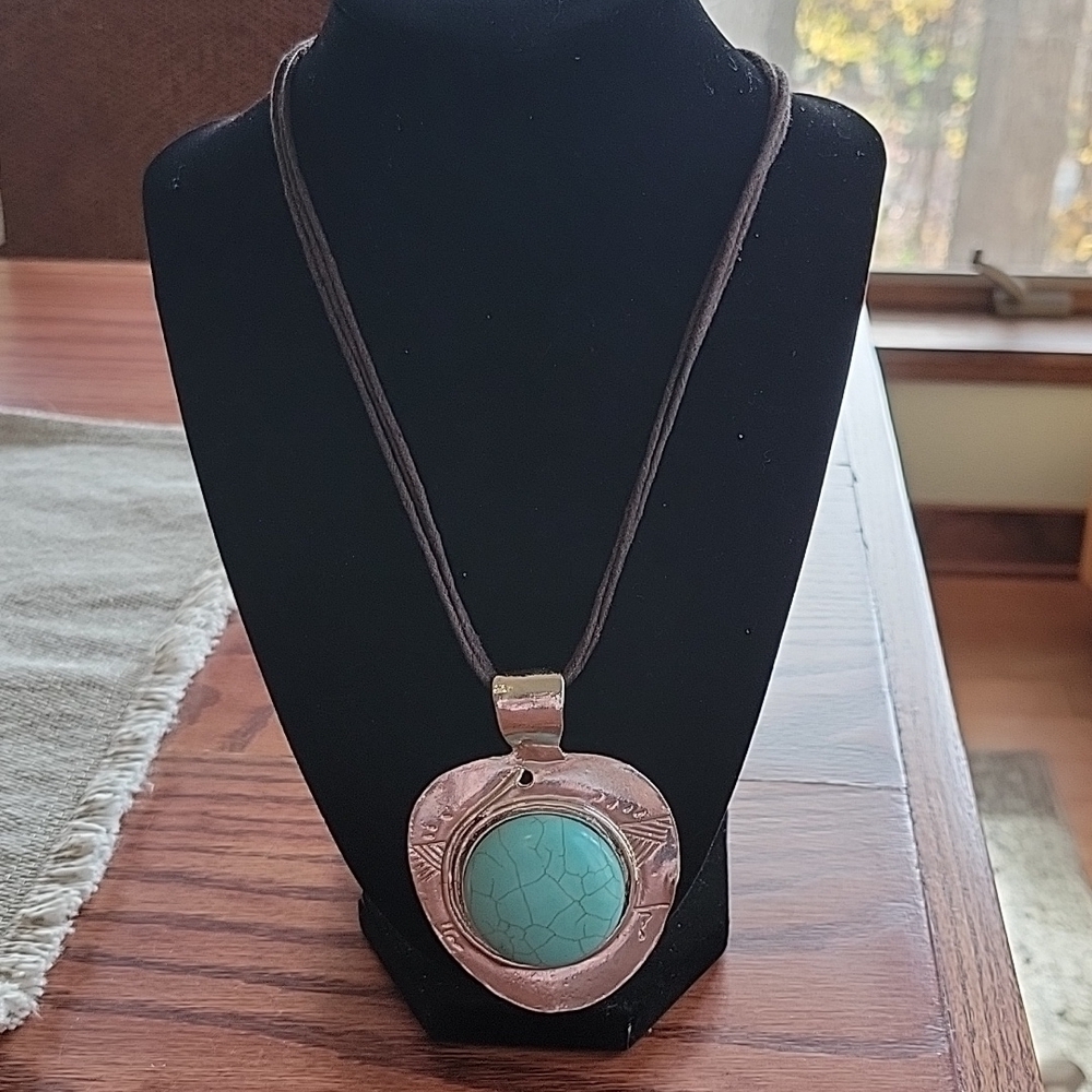 16" Turquoise silver necklace by Erica Lyons on a triple brown cord chain.